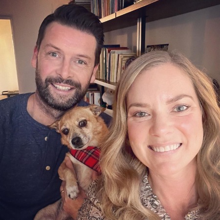 Cindy Busby and her husband Chris Busby with their pet dog Suzie.